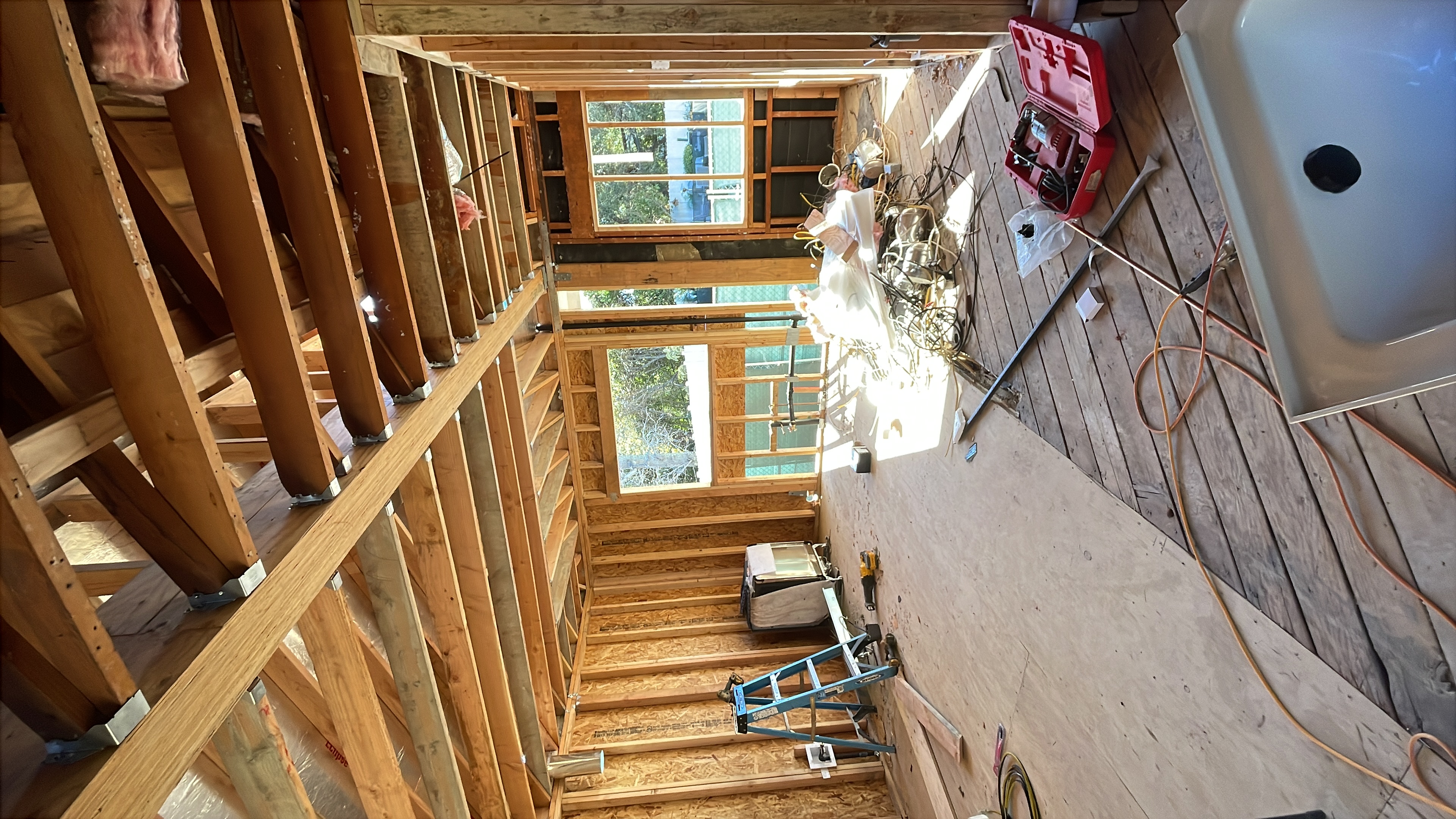 New home construction interior framing with vaulted ceiling rafters in Los Angeles