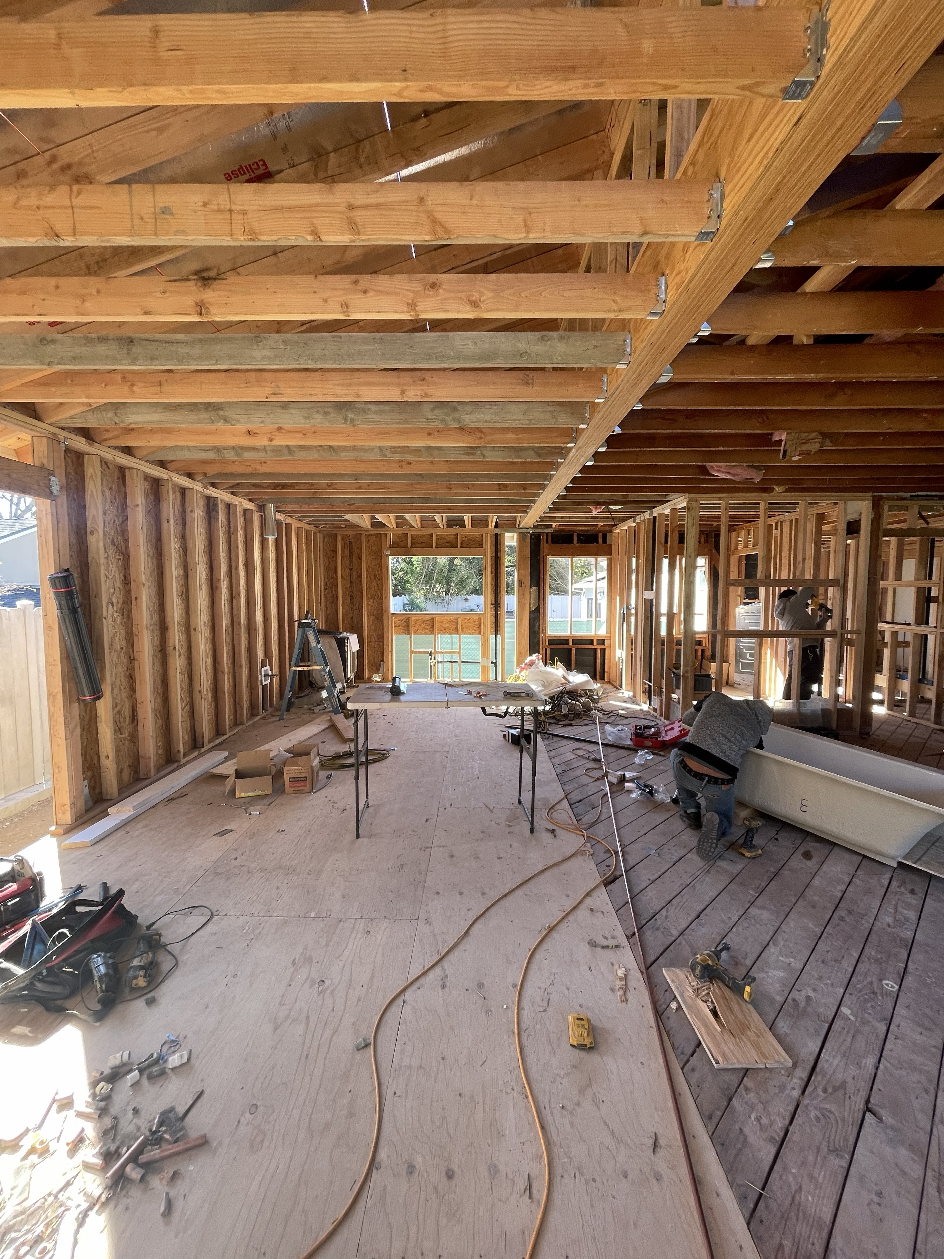 New home construction interior framing with open floor plan in Los Angeles