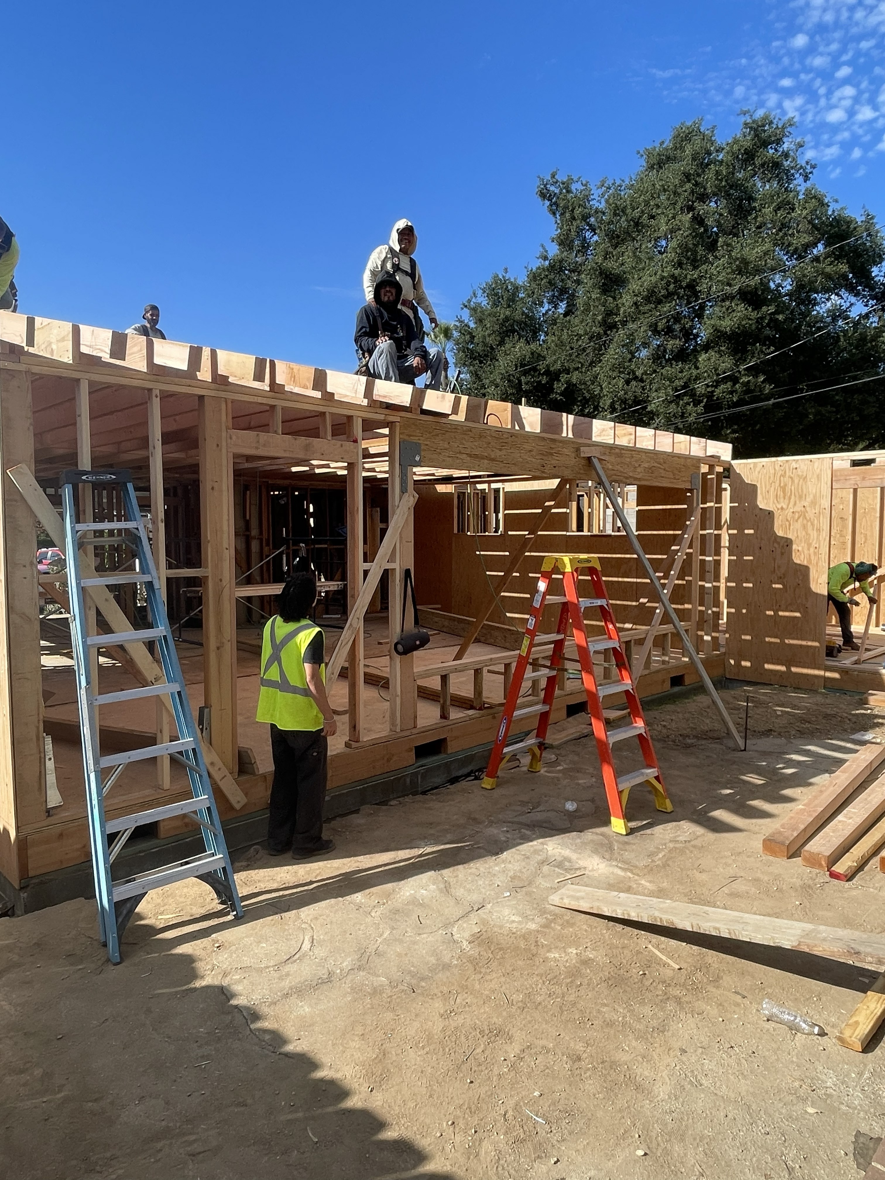 Luz Builders construction crew framing a room addition - Los Angeles